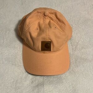 Women’s orange carhartt hat worn once has Velcro on the back with logo
